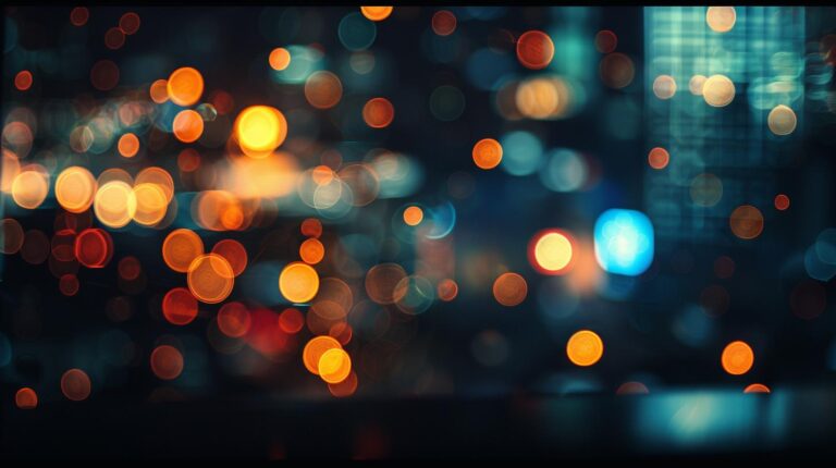 Abstract bokeh lights background with warm and cool colors in a blurred cityscape at night.